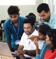 Coach Prasad guiding a student
